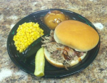 Pork sandwich with kernal corn and mashed potatos and gravy